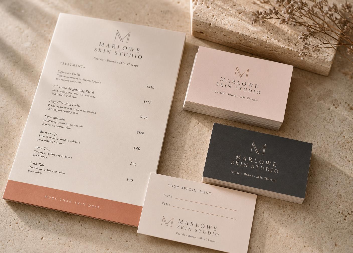 Marlowe Skin Studio price list and business cards on stone